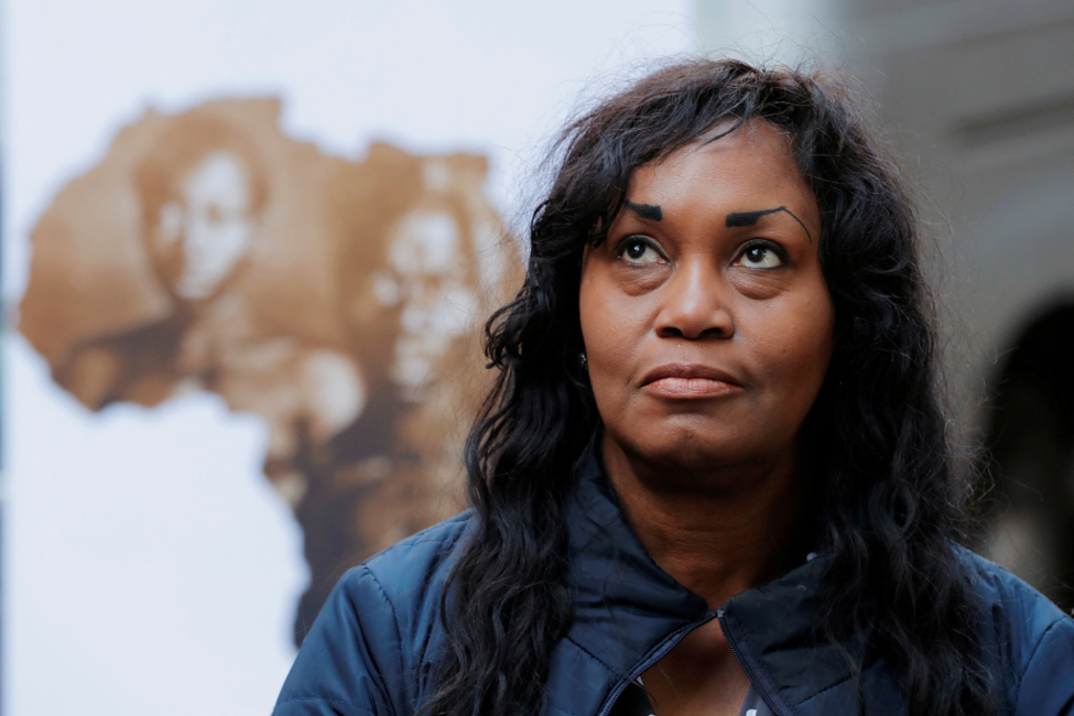 Tamara Lanier listens during a March 20, 2019, news conference in New York City announcing her lawsuit against Harvard University over photographs of her enslaved ancestors, Renty and Delia. Photo by Lucas Jackson/Reuters.